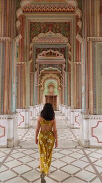 vertical Tourist walking in Jaipur City Palace, India