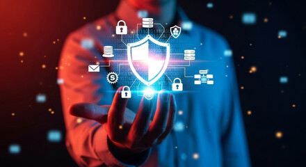 Obraz premium Person holding a glowing shield with cybersecurity icons and data streams