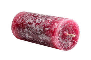 Red pillar candle with textured surface isolated on black background