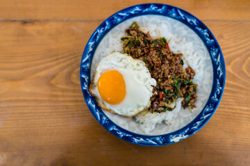 Pad Kra Pao is a Thai holy basil stir fry with ground beef topped with a runny fried egg. Thai phat kaphrao rice