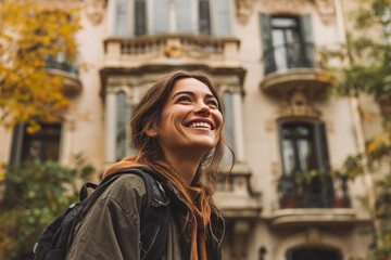 Fototapeta premium Joy Woman smiling, looking up with in a European city street