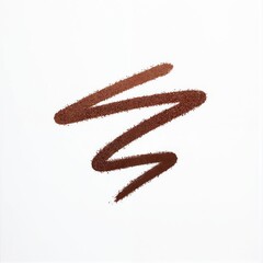 Brown eyeliner pencil smudge on white background. The cosmetic makeup trace shows a rough texture with graphite detail. Isolated macro shot of a chaotic scribble line.