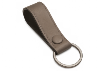 Sleek leather keychain hanging with metallic ring, showcasing minimalist design against transparent backdrop