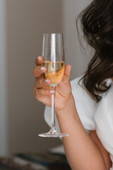 Bride Holding Champagne Glass In Hand