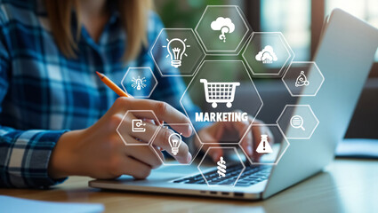 Woman working on laptop with digital marketing icons and technology overlay
