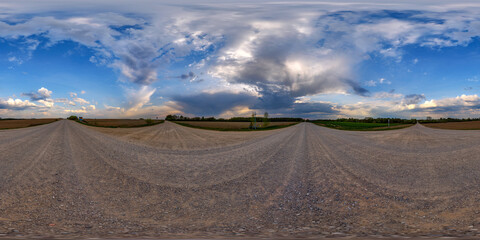 hdri 360 panorama view on crossroads of gravel country roads among fields with clouds in sky in equirectangular full seamless spherical projection, ready for VR AR or sky dome replacement © hiv360