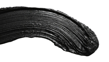Close-up of a dark, smudged, textured black cosmetic product smear.  A sweeping, curved application mark against a pure black background