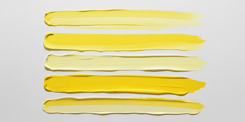 Obraz premium Yellow paint swatches on white background brush strokes color palette