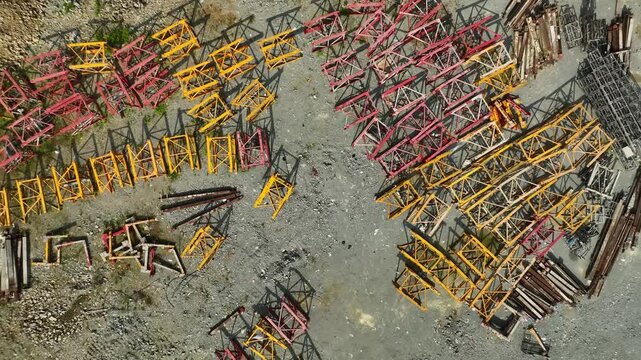 Aerial View of Colorful Construction Materials and Scaffolding in a Construction Site for Urban Development