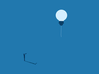 businessman looks at a distant dream, a lightbulb floating away