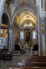 A photo of a church with a large painting on the ceiling