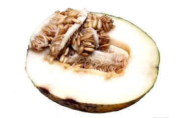 ripe juicy melon. melon in a cut with many seeds on top on a white background