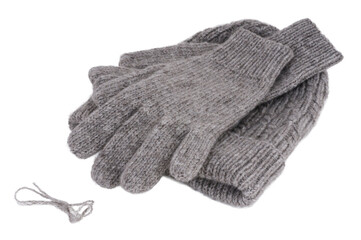 Gray wool gloves and hat isolated on white background. Gray wool gloves.