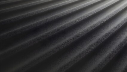 Fototapeta premium The image shows a textured, dark gray corrugated surface with a light gradient, symbolizing depth and movement.