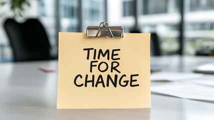 A notepad displaying "Time for Change" on a table, suggesting a moment for reflection, growth, and progress in professional settings.