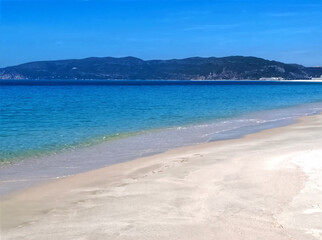 Famous paradise beach in Troia near Lisbon in Portugal with white sand and deep blue sea