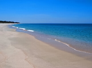 Famous paradise beach in Troia near Lisbon in Portugal with white sand and deep blue sea