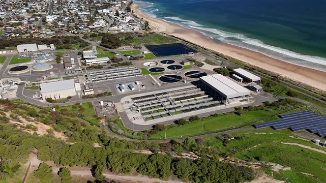 SA Water Christies Beach Wastewater Treatment Plant, O'Sullivan Beach, South Australia: 4K Aerial Drone Footage of Coastal Facility, Clarifier Tanks, Infrastructure, Solar Panels, and Nearby Beach