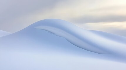 Soft Curves of Snow Dunes Under Gentle Light in Winter Landscape