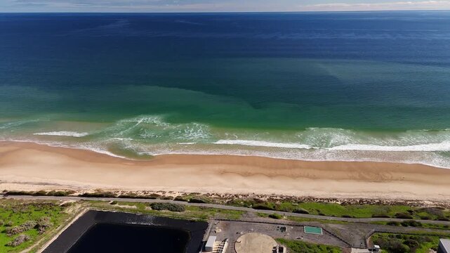 SA Water Christies Beach Wastewater Treatment Plant, O'Sullivan Beach, South Australia: 4K Aerial Drone Footage of Coastal Facility, Clarifier Tanks, Infrastructure, Solar Panels, and Nearby Beach
