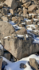 Yerevan, Armenia: February 7, 2024 – Snow-covered basalt rocks near Garni Gorge