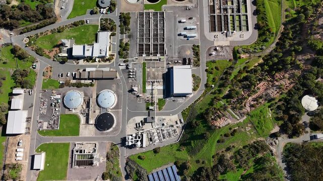 SA Water Christies Beach Wastewater Treatment Plant, O'Sullivan Beach, South Australia: 4K Aerial Drone Footage of Coastal Facility, Clarifier Tanks, Infrastructure, Solar Panels, and Nearby Beach