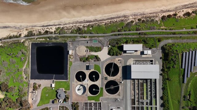 SA Water Christies Beach Wastewater Treatment Plant, O'Sullivan Beach, South Australia: 4K Aerial Drone Footage of Coastal Facility, Clarifier Tanks, Infrastructure, Solar Panels, and Nearby Beach