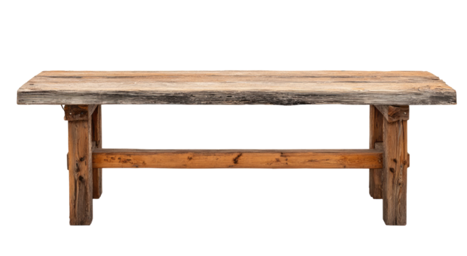 Rustic wooden workbench.  A simple, aged wooden table with a wide, plank top and sturdy, exposed wooden legs and supports