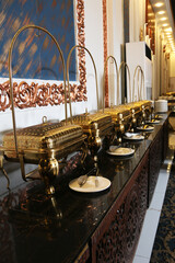Elegant Buffet Presentation with Golden Chafing Dishes