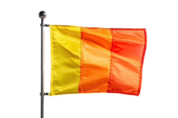 A three-color flag, yellow, orange, and red, billowing in the wind, mounted on a metal pole
