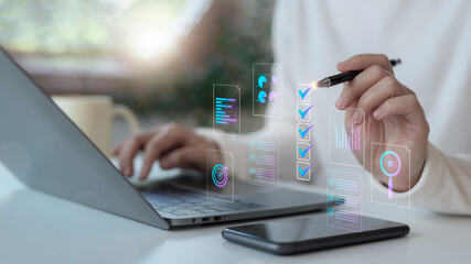 Hand using a digital checklist interface with charts and AI icons on a laptop. Concept of online workflow automation, task management, and digital transformation in business.