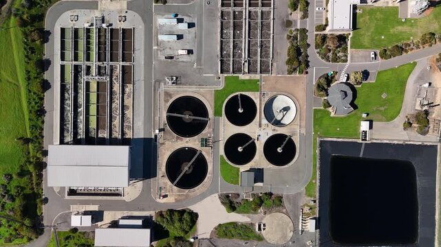 SA Water Christies Beach Wastewater Treatment Plant, O'Sullivan Beach, South Australia: 4K Aerial Drone Footage of Coastal Facility, Clarifier Tanks, Infrastructure, Solar Panels, and Nearby Beach