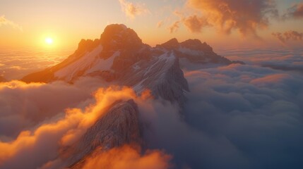 Fototapeta premium Majestic Sunset Over Mountain Peaks Above a Sea of Clouds