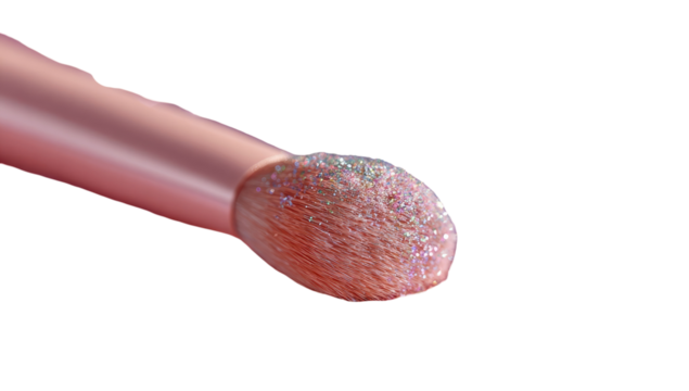 Close-up of a blush brush tip, rose gold color, covered in shimmering, light pink glitter