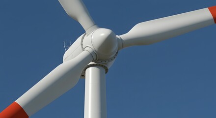 Wind Turbines Windmill Energy. Wind turbine with white blades and red tips spinning against a clear blue sky.
