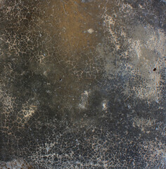 Cracked Dark Surface. Close-up of a dark cracked surface with fine web-like lines, evoking an aged or weathered appearance.