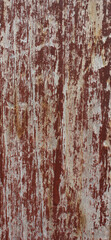 Cracked Red Painted Wood. Close-up of red painted wood with large cracks and weathered paint, showing deep texture and age.