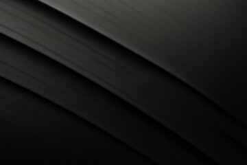 Obraz premium Dark, sleek curves of black material creating a modern and minimal abstract background with elegant texture.