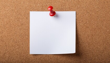 a blank white note is pinned to a brown corkboard with a red pushpin