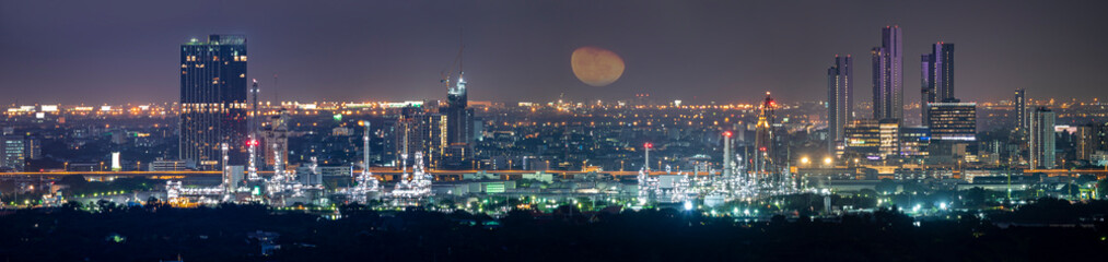 Fototapeta premium Oil refinery industry plant along twilight morning