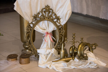 Decorative arrangement of vintage items and elegance in a lavish setting with soft lighting and ornate details