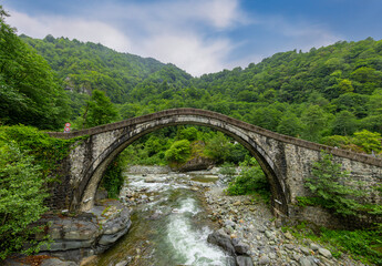 Historical bridges and rivers firtina rivers and cifte bridge Turkey. Old and historic bridges green nature, on river Artvin turkey. ''Cifte Kopru''double bridge area.