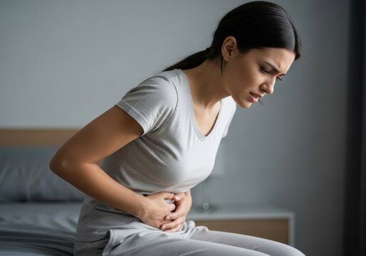 Woman Experiencing Abdominal Pain Understanding Stomach Discomfort and Relief Strategies, Managing Digestive Issues and Health Care Advice