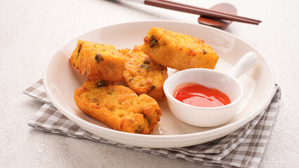 Homemade tofu nuggets served with chilli sauce
