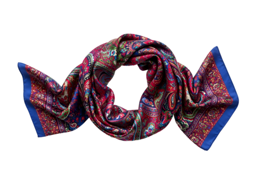 Vibrant paisley patterned silk scarf against a black background. - Powered by Adobe