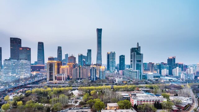 High angle night view Day-to-Night timelapse of International Trade Center CBD complex and overpass in Beijing, China