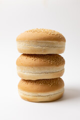 Homemade burger buns with sesame seeds, golden crust, soft fluffy texture, freshly baked bread, perfect for sandwiches and burgers.
