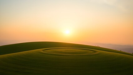 Fototapeta premium Sunset and sunrise over a rural field with road and cloudy sky in the background