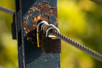 Love Locks on a Rusty Bridge Railing