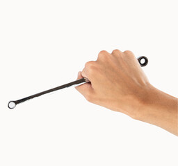 Hand holding a wrench on a white background